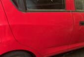 Afbeelding 1 van linksachter rood 4-deurs Chevrolet Spark ('10-'14)